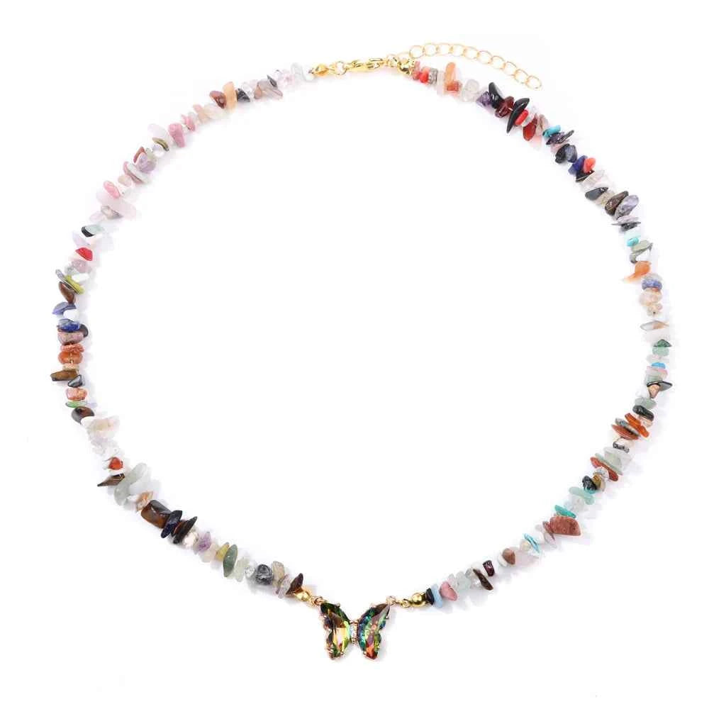 Fashion butterfly crystal collar with purple amethyst stones, stylish jewelry by Corporación Turística, close-up of colorful gemstone design.