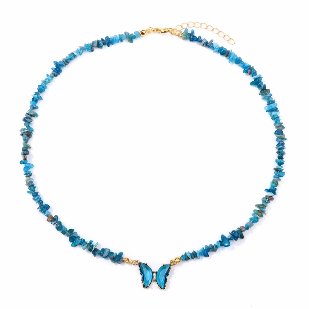 Fashion butterfly crystal collar featuring purple amethysts, crafted by Corporación Turística, with vibrant aquamarine accents.