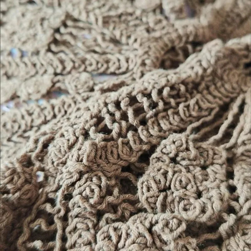 Lightweight summer crochet knit sweater for women by Corporación Turística, featuring a delicate, airy design suitable for warm weather.