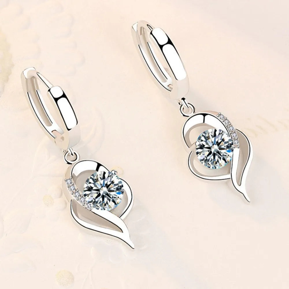 Sterling silver 925 earrings with sparkling crystal cubic zirconia from Corporación Turística, showcasing elegant dangling design.