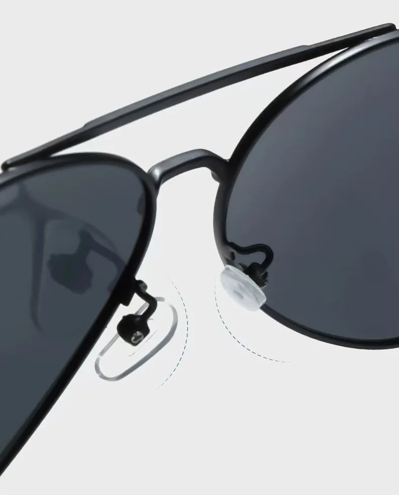 Polarized sunglasses with metal frame for men, stylish and durable, featuring dark tinted lenses and sleek metal construction.
