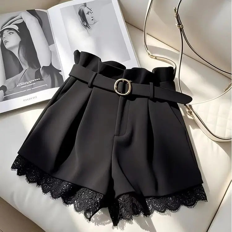 High-waisted black fashion shorts for women by Corporación Turística, slim fit style, shown on a model.