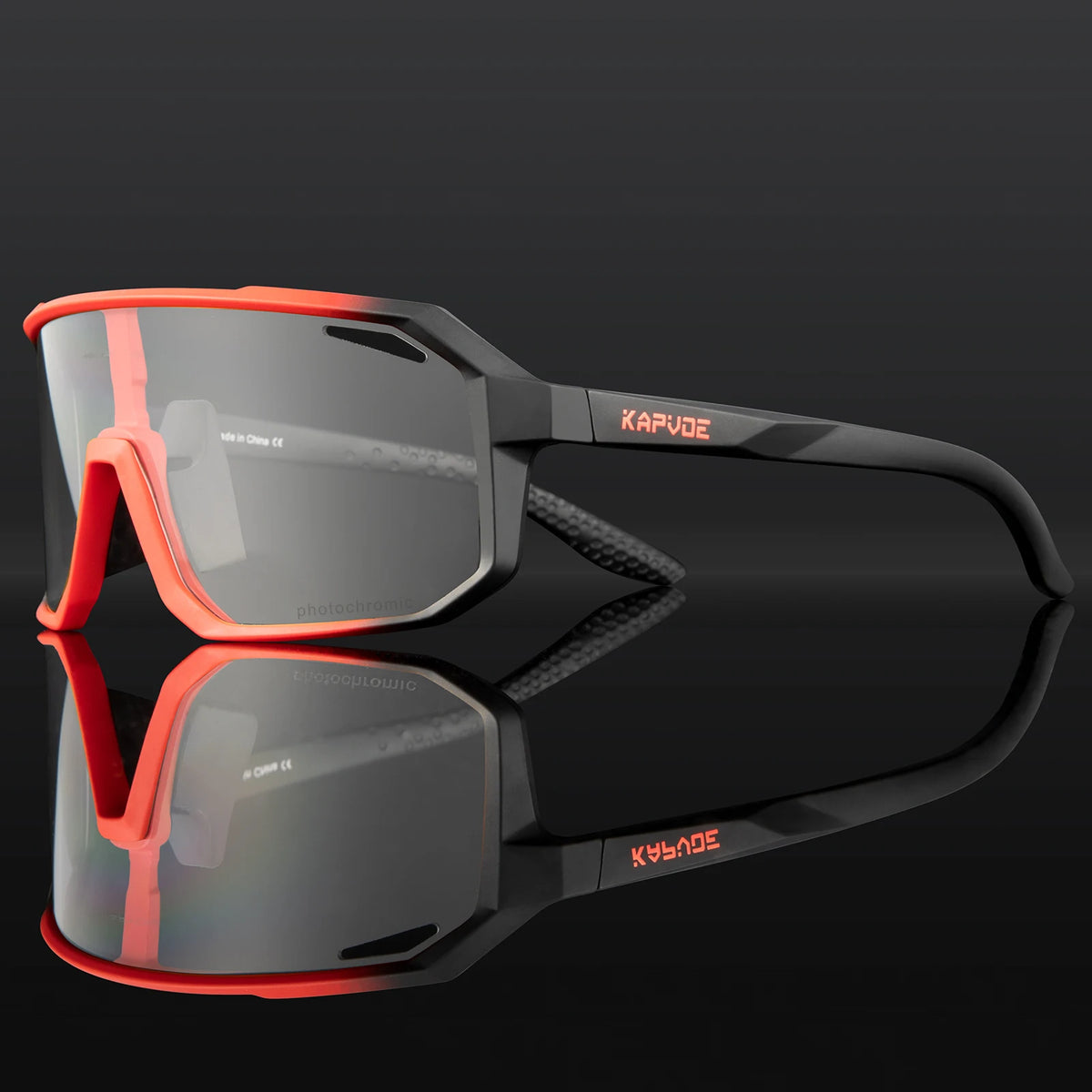 Kapvoe photochromic MTB sunglasses with clear and tinted lenses for cycling, designed for outdoor biking by Corporación Turística.