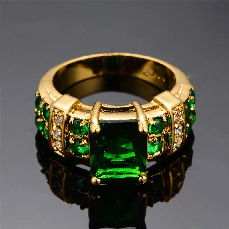 Green crystal fashion ring with a sleek design, suitable for wedding or special occasions, by Corporación Turística.