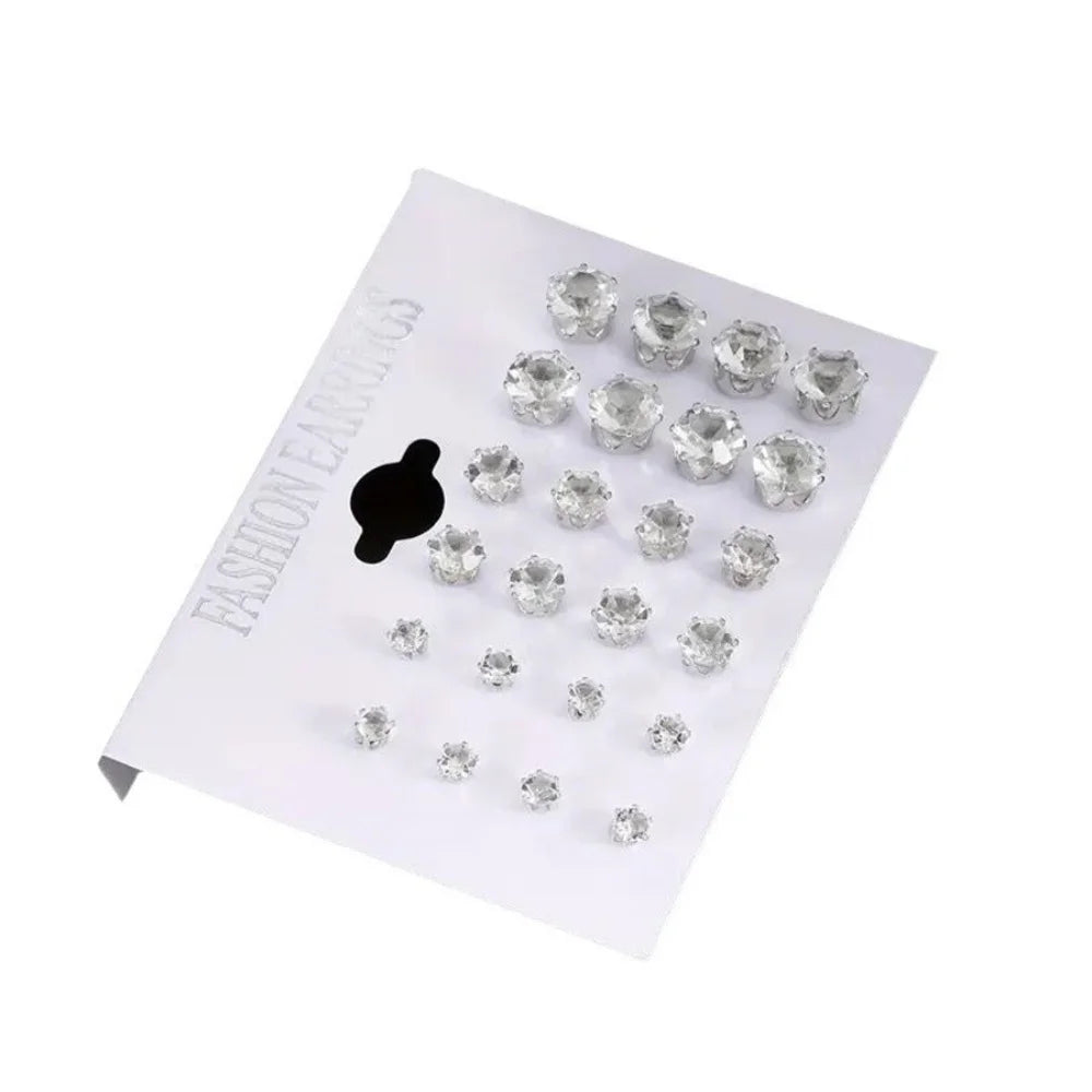 Set of 12 pairs of zirconia screw earrings by Corporación Turística, featuring shiny, silver-tone metal and secure screw-back design.