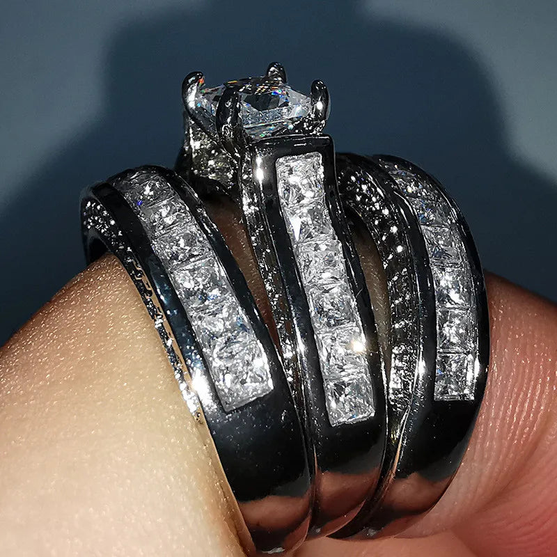 Set of three fashionable 925 sterling silver rings with sleek, modern designs, perfect for stylish jewelry collection.