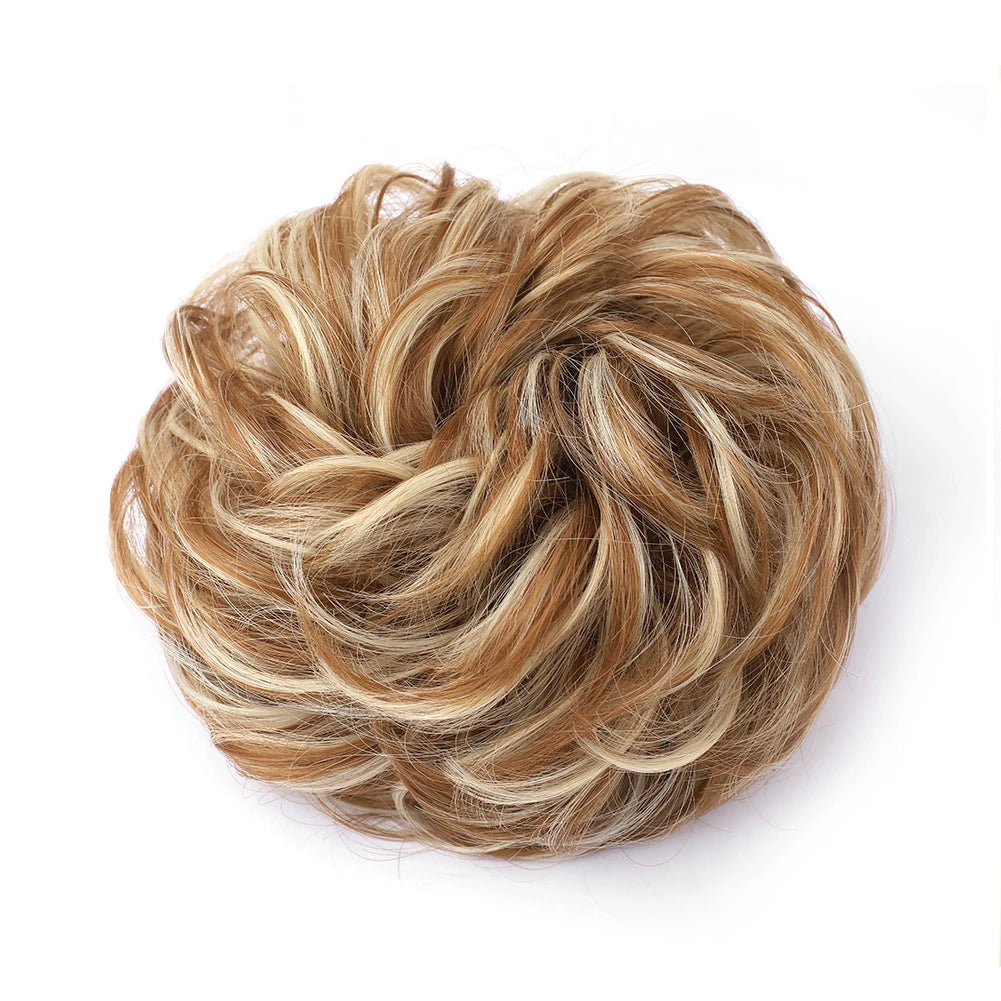 Large messy bun hairstyle with wavy, curly hair piece by Corporación Turística, showcasing a stylish, tousled hairdo.