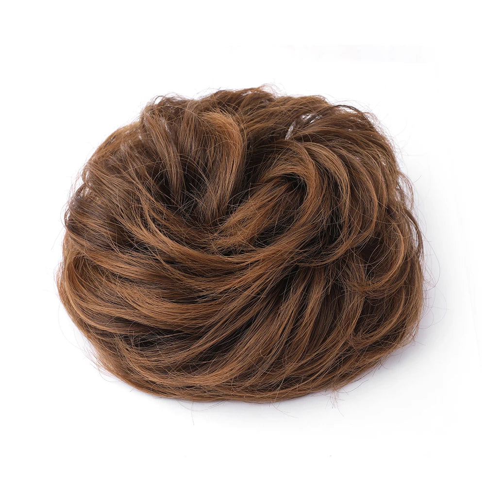 Large messy bun hairpiece with wavy and curly hair, styled by Corporación Turística, showcasing a voluminous, tousled hair accessory.