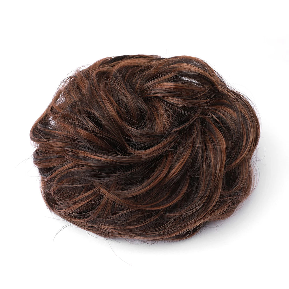 Large messy bun hairstyle featuring wavy and curly hair, created by Corporación Turística.