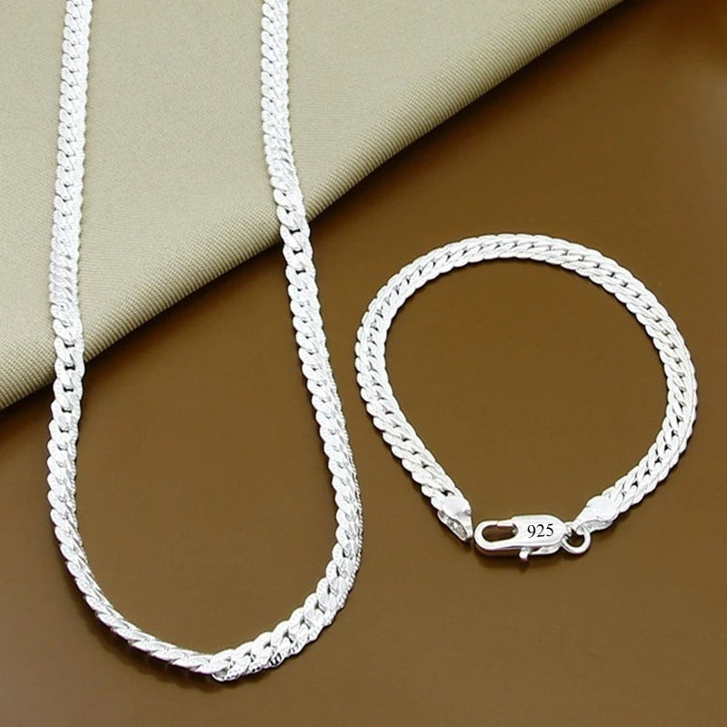 Fine Brands sterling silver jewelry set with necklaces and bracelets, featuring 18cm and 55cm chains, by Corporación Turística.