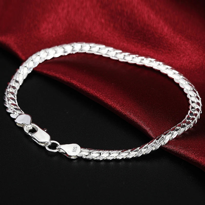 Fine Brands sterling silver jewelry set with necklace and bracelet, featuring detailed craftsmanship and elegant design.