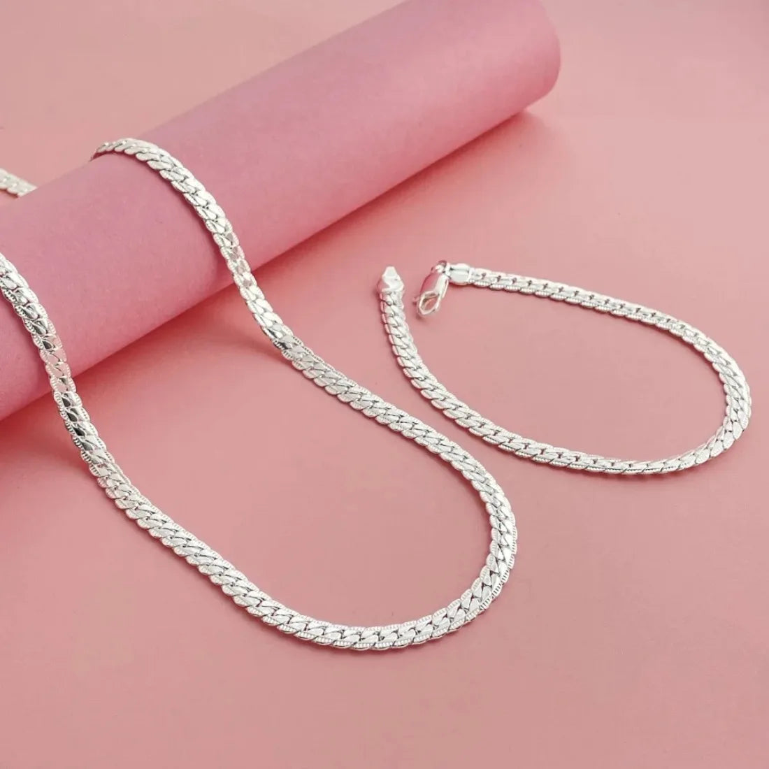 Fine Brands silver jewelry set featuring 18cm and 55cm chains with 925 sterling silver, crafted by Corporación Turística.