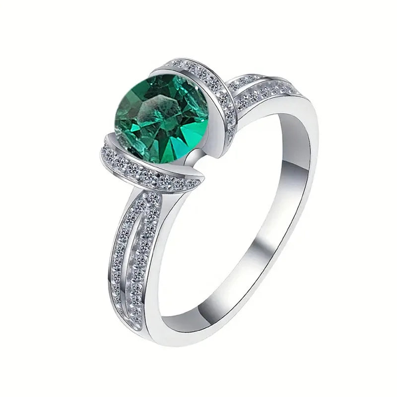 Sterling silver green cubic zirconia ring with band design, from Corporación Turística, showcasing a vibrant gemstone setting.
