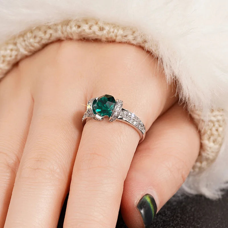 Sterling silver green cubic zirconia ring with band design, crafted by Corporación Turística.
