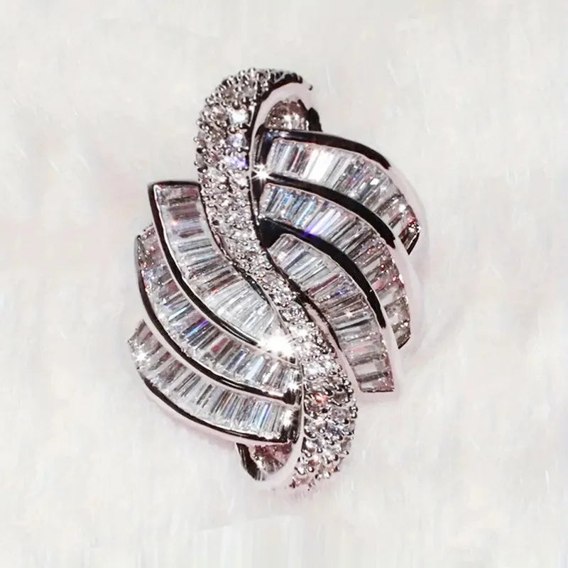 Sterling silver 925 wedding rings with intricate designs, ideal for bridal accessories, displayed on a neutral background.