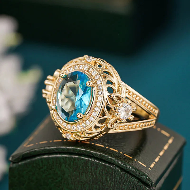 Sterling silver 925 ring with blue cubic zirconia and vin-inspired design, detailed close-up of the jewelry piece.