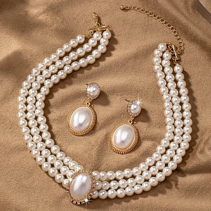 Elegant imitation pearl necklace and matching earrings set from Corporación Turística, featuring shiny pearls and classic design.