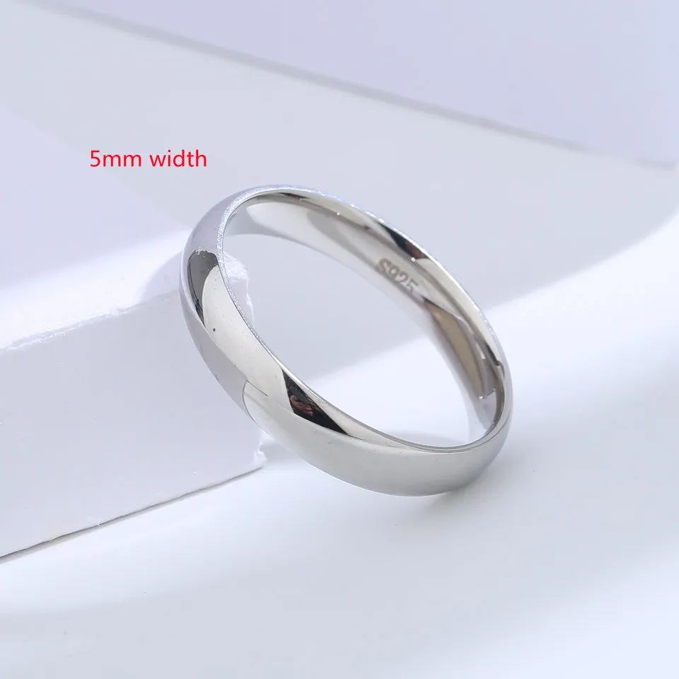 Sterling silver 925 couples ring by Buyee, featuring a sleek design for romantic partners, on a neutral background.