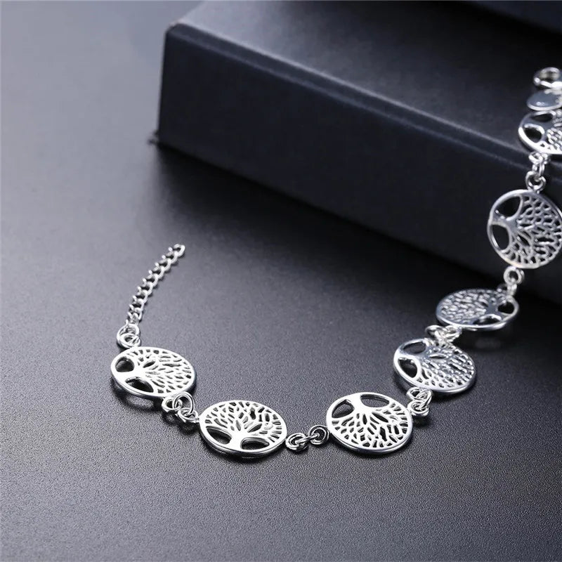 Sterling silver 925 bracelet with beautiful tree flower designs, showcasing intricate floral details and elegant craftsmanship.