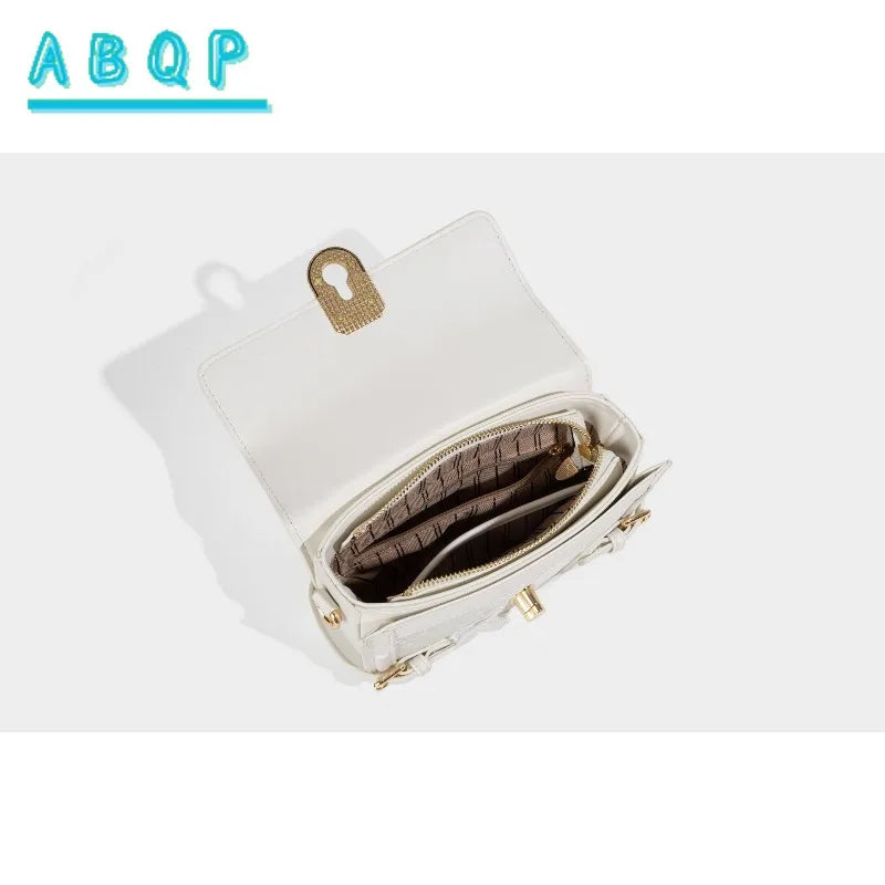 Luxury women's shoulder bag from ABQP by Corporación Turística, featuring a sleek design and elegant construction.