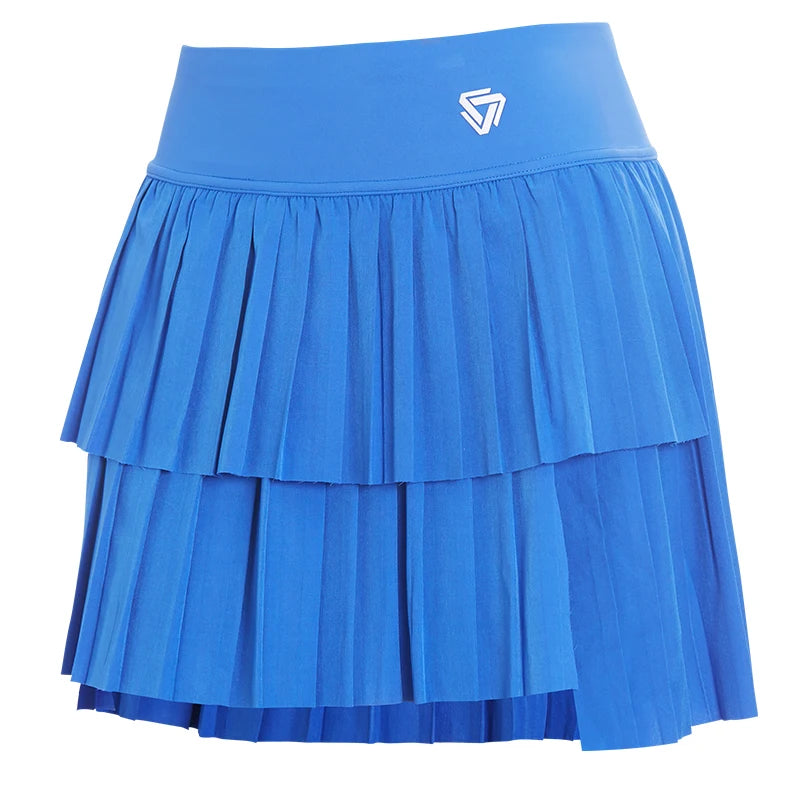 Mint green women's sporty pleated mini skirt for tennis, made by Corporación Turística, shown on a model ready for active play.