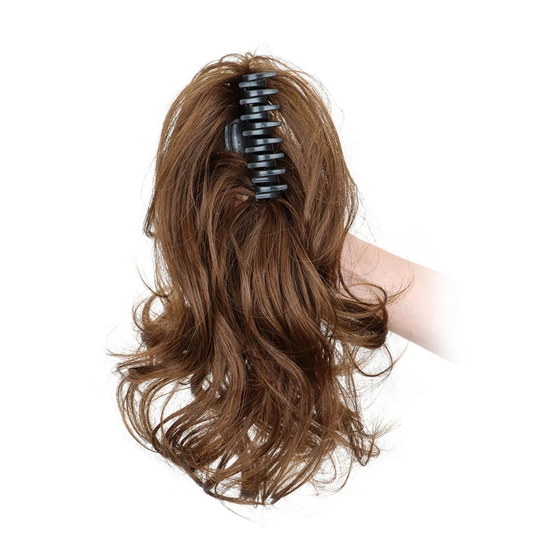 Synthetic 12-inch ponytail extensions by Corporación Turística, shown in natural black with a shiny, smooth texture.