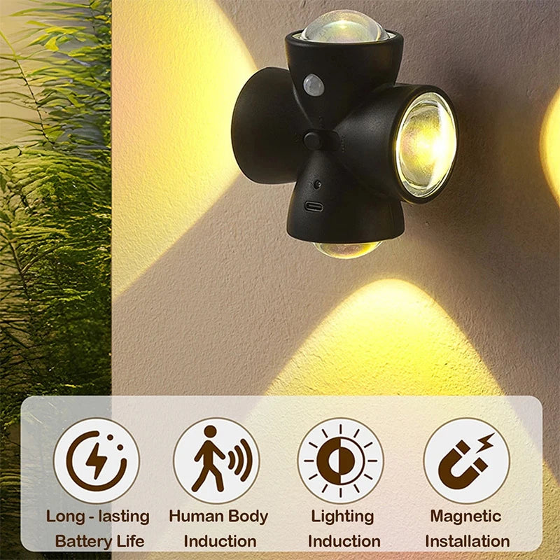 Black LED night lamp with four heads and motion sensor, designed for easy illumination in dark spaces.