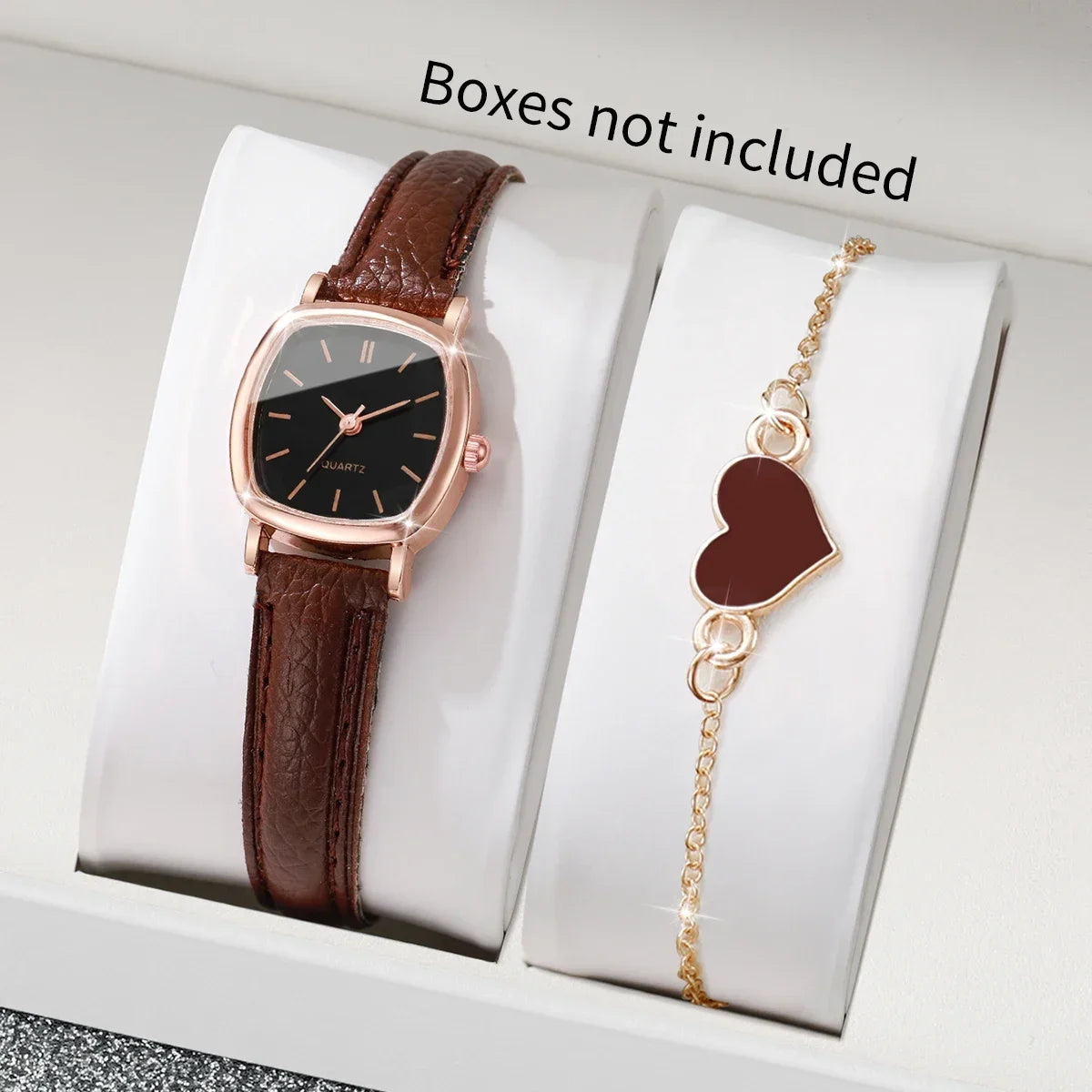 Two rose gold square quartz women's watches by Corporación Turística, featuring sleek design and elegant watch faces.