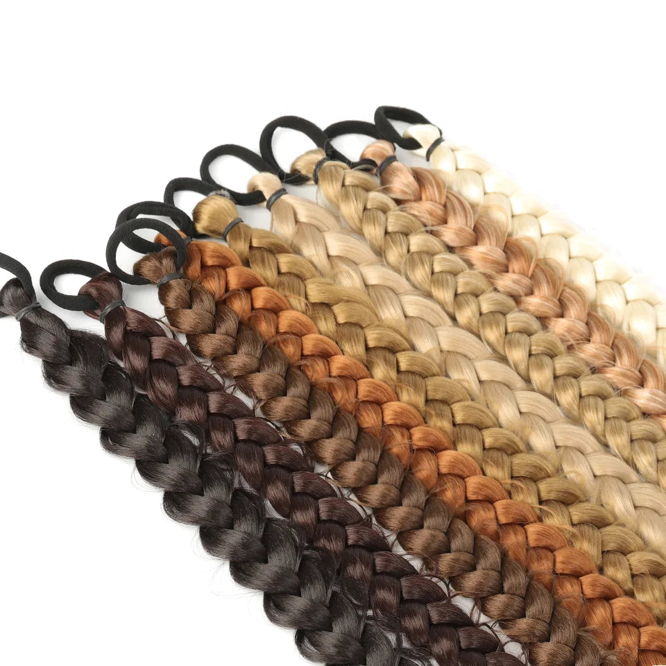 Trenzed ponytail hair extensions from Corporación Turística, featuring natural-looking woven design and dark brown color.