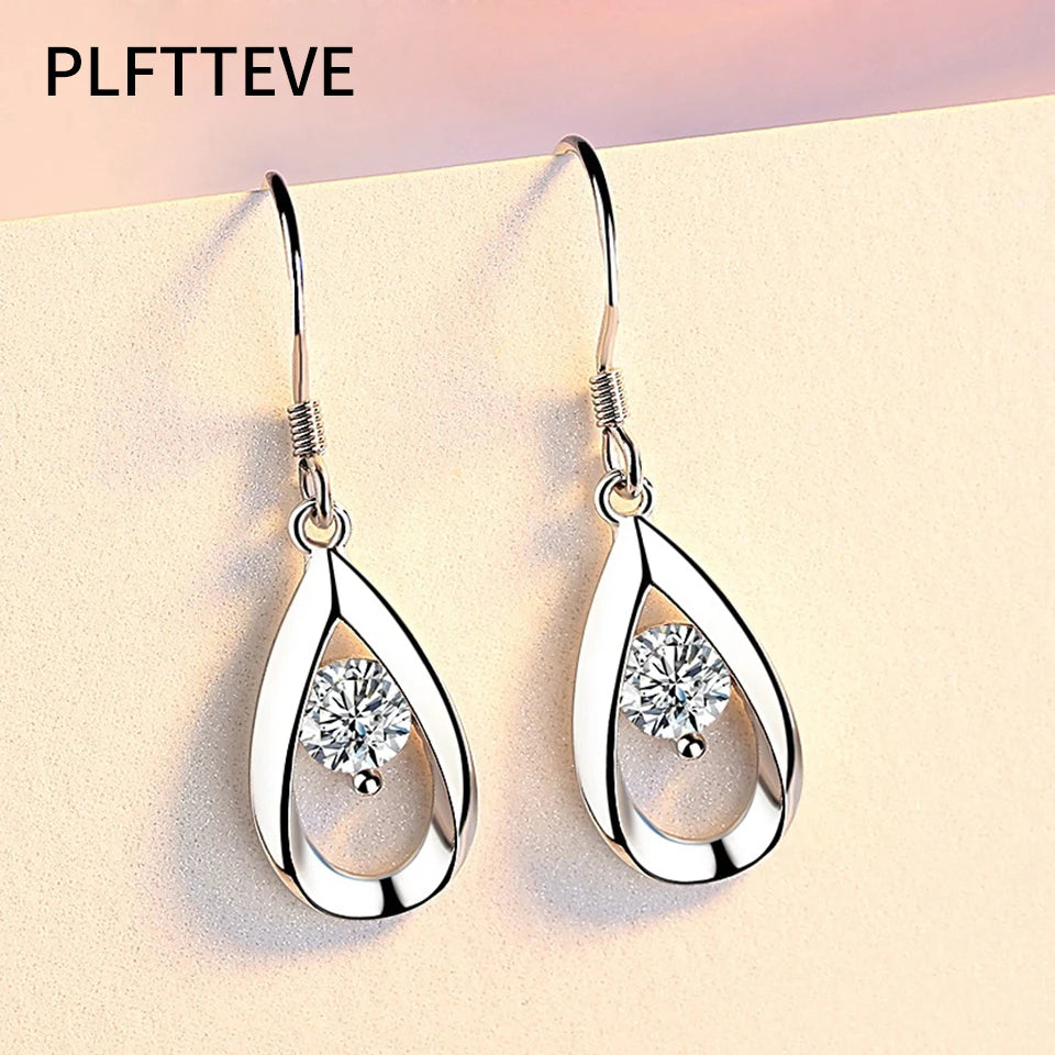 Elegant water drop-shaped zircon earrings for women, featuring sparkling gemstones and a sleek silver setting.