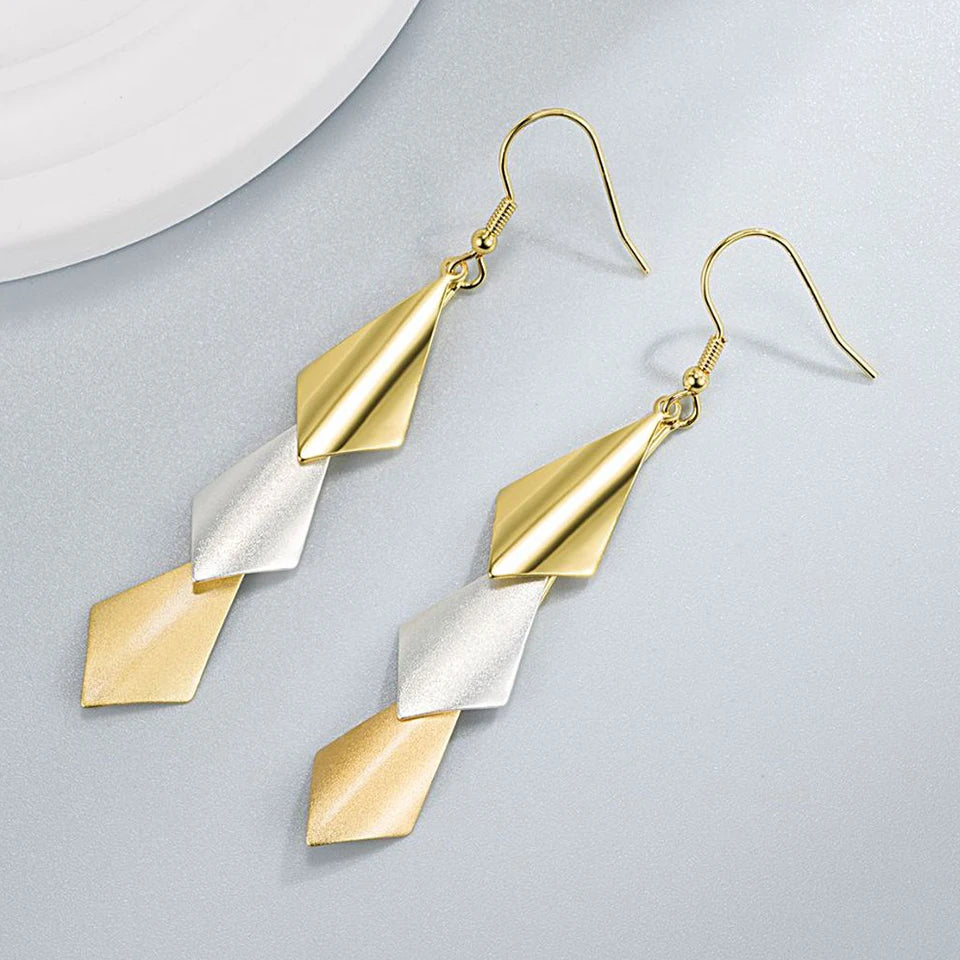 Elegant water drop-shaped zircon earrings for women with sparkling stones, featuring a silver-tone design.