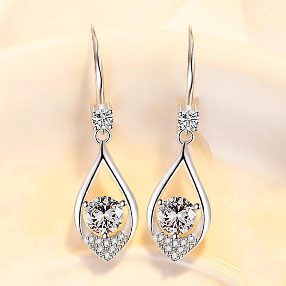 Water drop-shaped cubic zirconia earrings for women, silver-toned drop earrings with sparkling stones, elegant jewelry accessory.