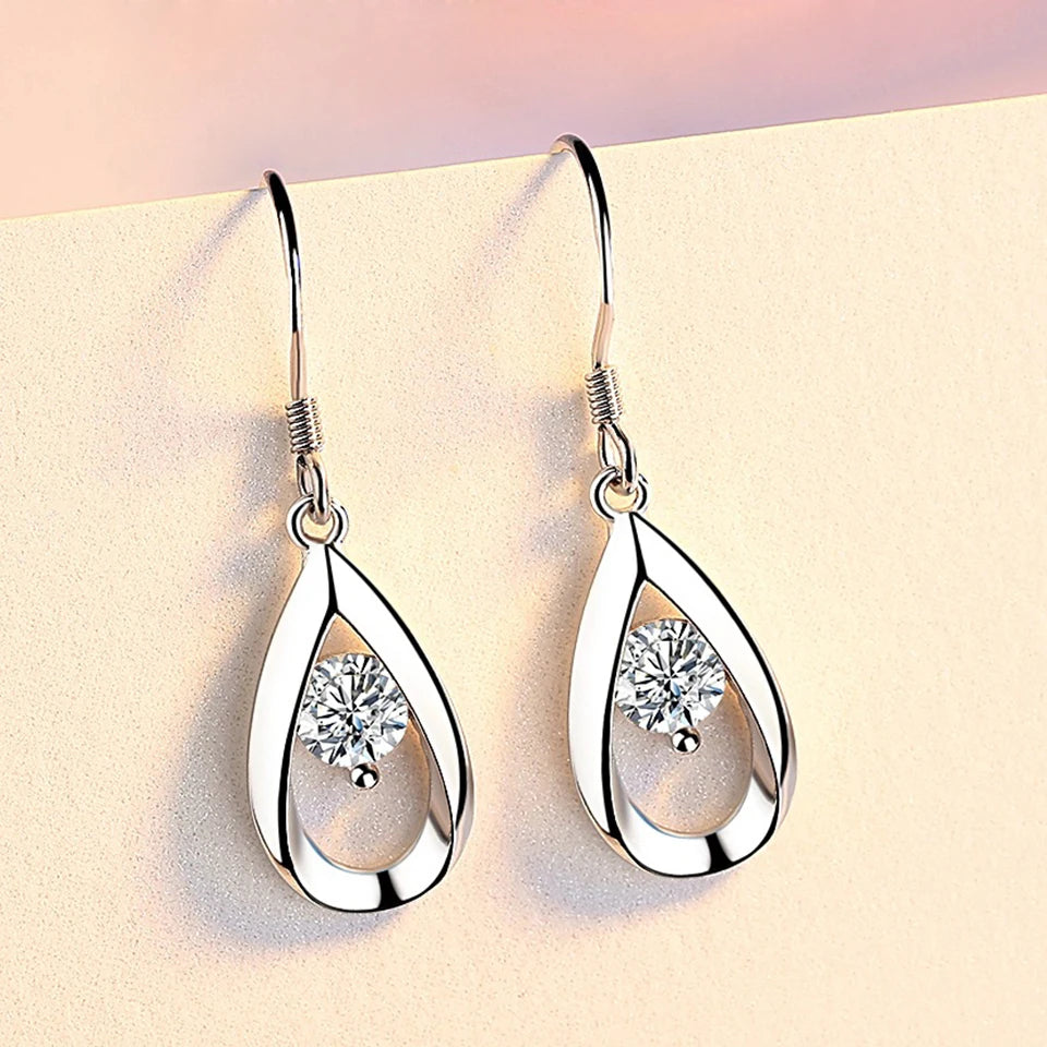 Elegant water drop-shaped cubic zirconia earrings for women, featuring sparkling stones and silver-tone hooks.