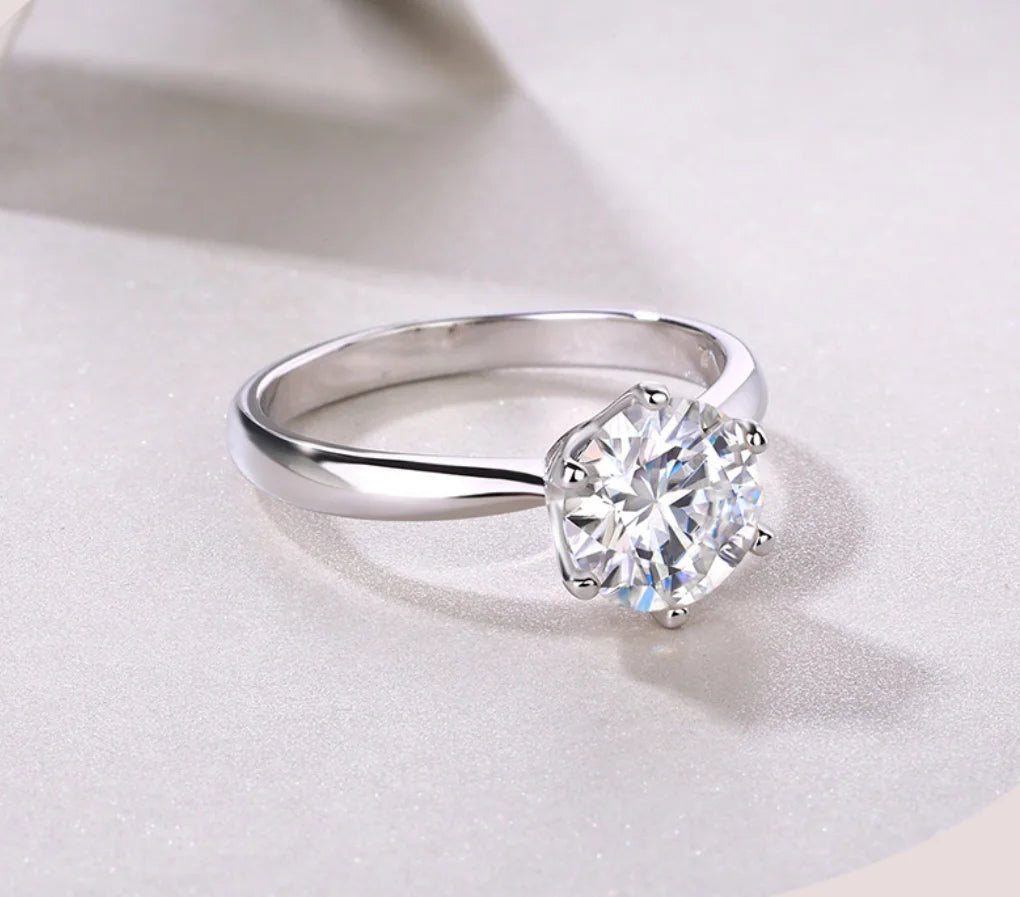 Sterling silver 925 ring with a 9mm 3-carat moissanite gemstone, luxurious and sparkling jewelry piece.