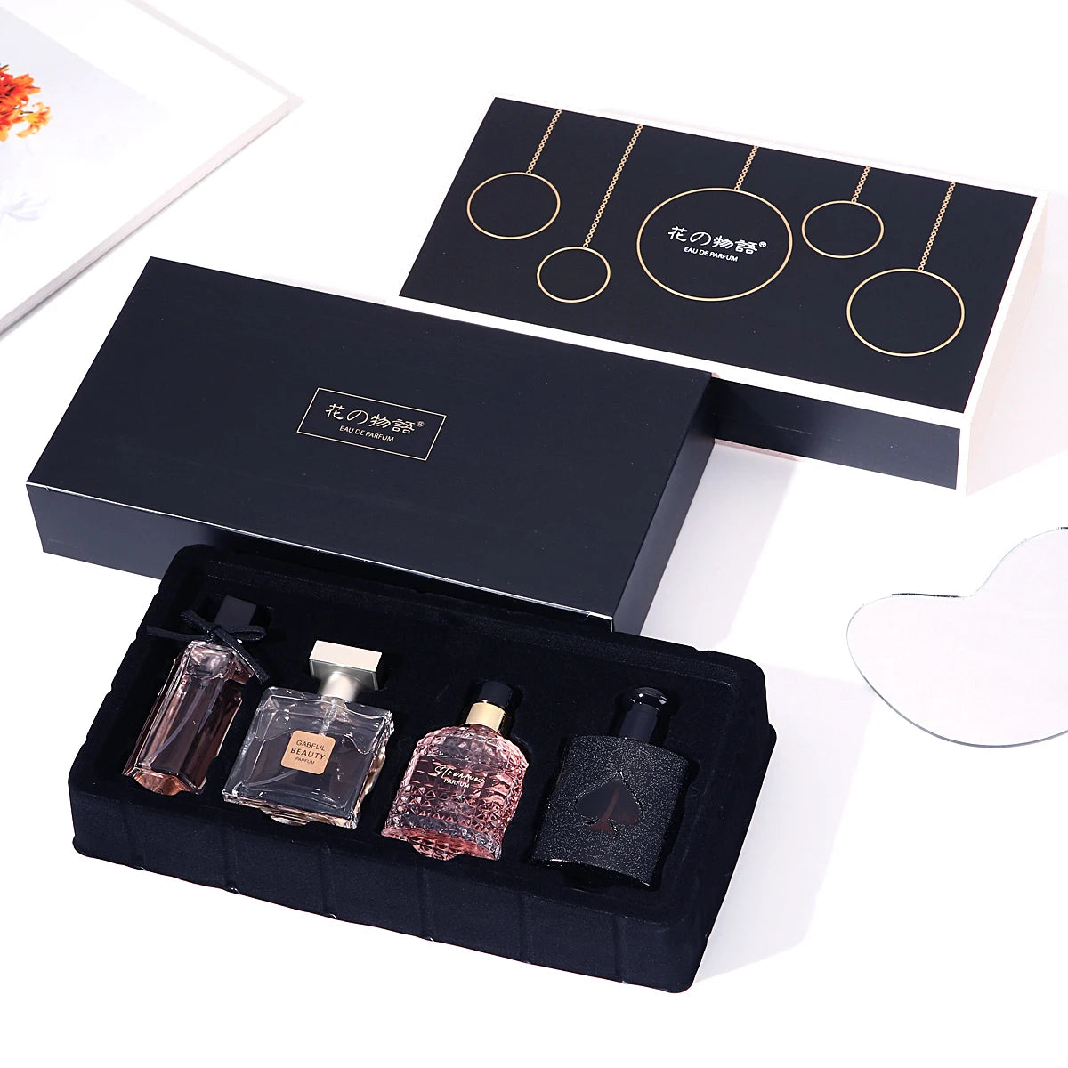 Elegant gift box featuring FloralVerse 4-in-1 perfume collection from Corporación Turística, showcasing four beautifully packaged perfume bottles.