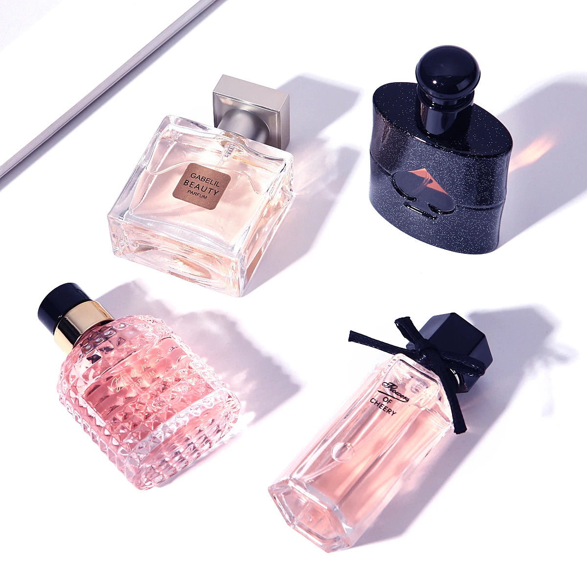 Four-pack FloralVerse perfume gift set in a box by Corporación Turística, featuring floral scents and elegant packaging.