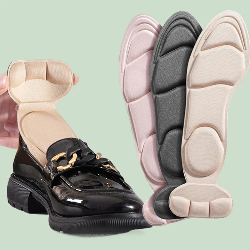Set of four black viscoelastic foam insoles for women’s shoes, designed for added comfort and support.