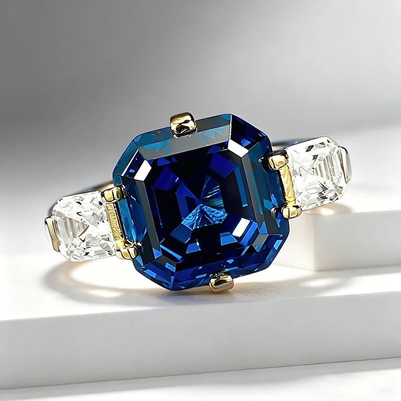 Elegant luxury jewelry piece in solid 18K white platinum from Corporación Turística, featuring a sleek blue gemstone accent.
