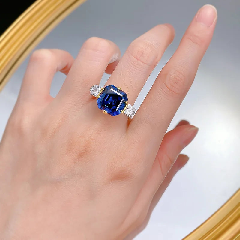 Luxury 18K solid white platinum jewelry by Corporación Turística, featuring elegant blue gemstone accents.