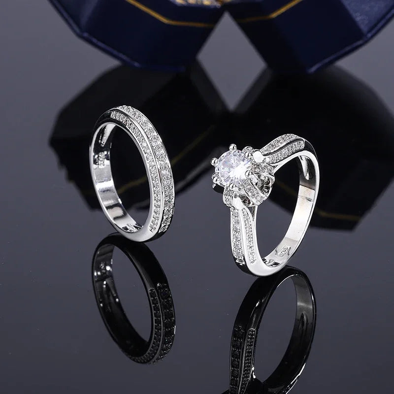 Set of high-quality crystal cubic zirconia wedding rings from Corporación Turística, showing intricate band details and sparkling stones.