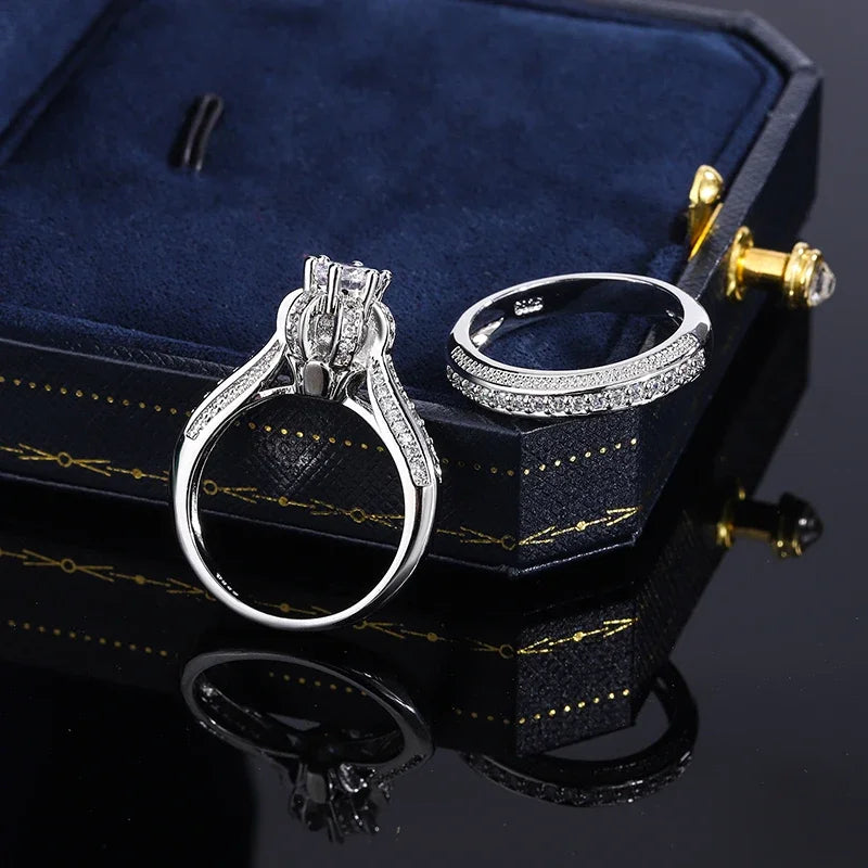 High-quality crystal cubic zirconia wedding ring set by Corporación Turística, featuring elegant silver bands with sparkling stones.