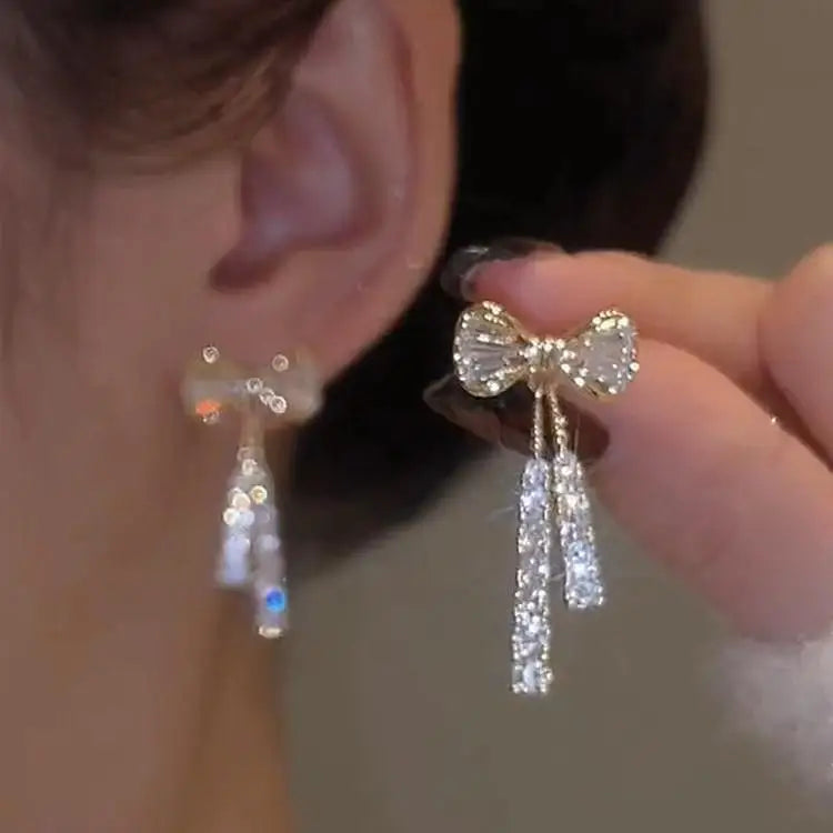 Purple crystal heart drop earrings for women, featuring elegant dangling design from Corporación Turística.
