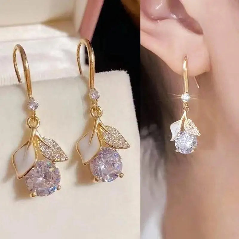 Purple crystal heart drop earrings for women, featuring elegant dangling design by Corporación Turística.