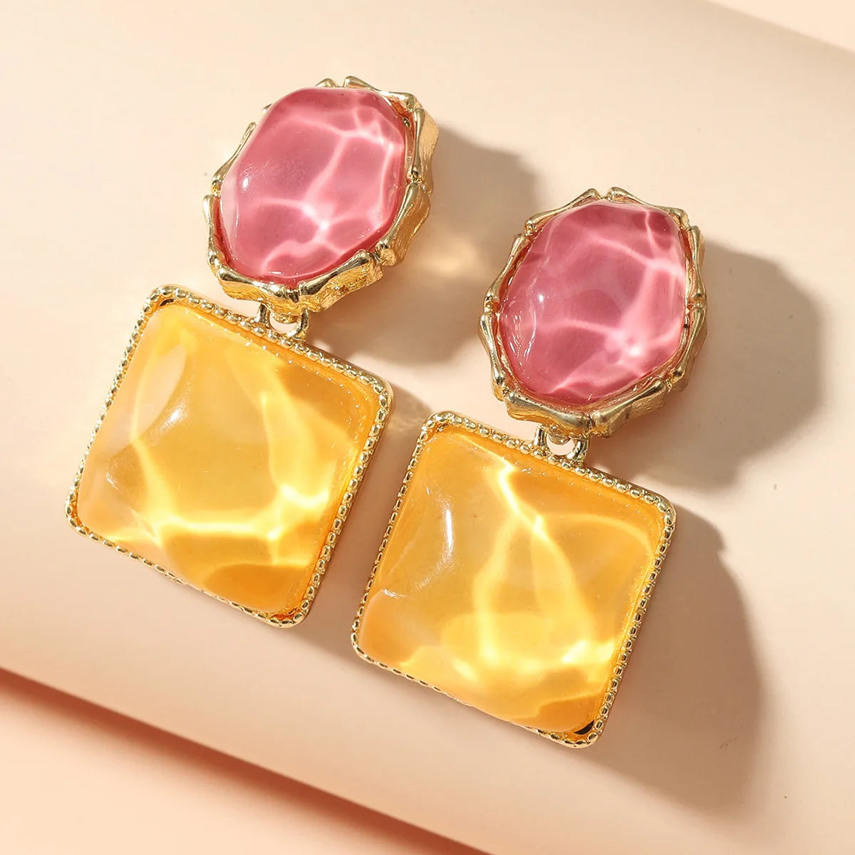 Purple crystal heart drop earrings for women, featuring elegant teardrop design, from Corporación Turística.