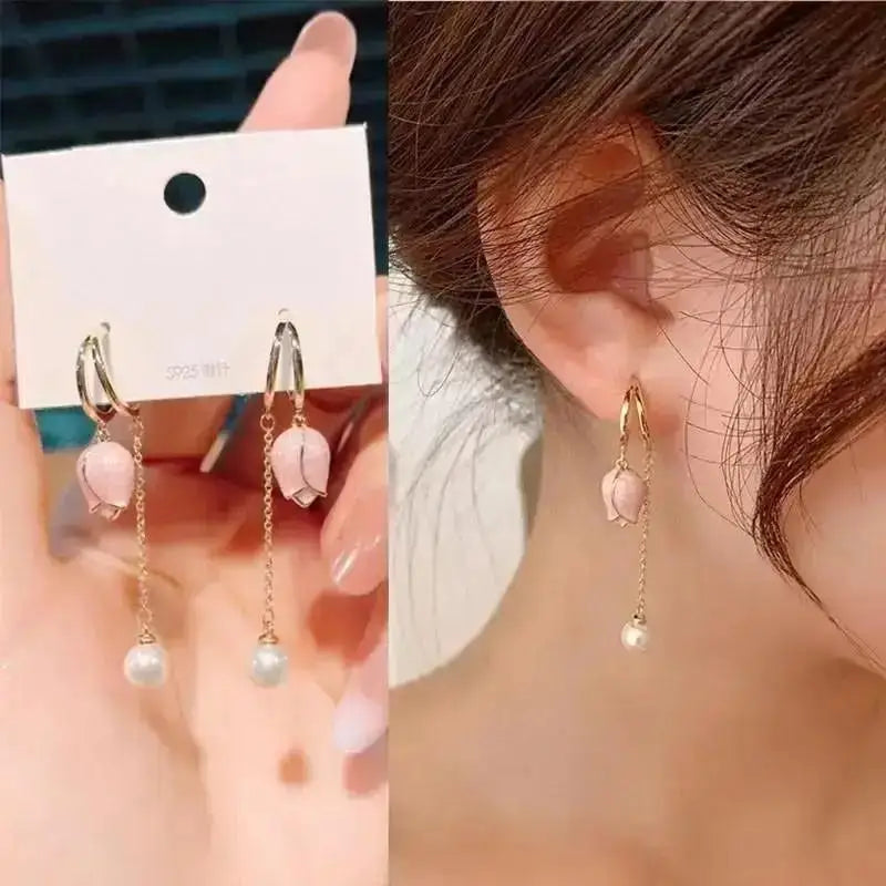 Purple crystal heart drop earrings for women, elegant jewelry by Corporación Turística showing the detailed gemstone design.