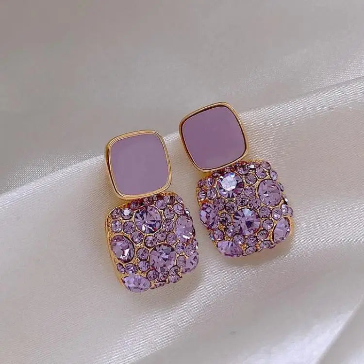 Purple crystal heart drop earrings for women, featuring elegant gemstone design from Corporación Turística.