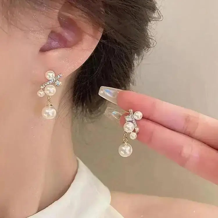 Korean style pearl tassel earrings with a needle, featuring small 5mm crystal beads for a fashionable and elegant look.