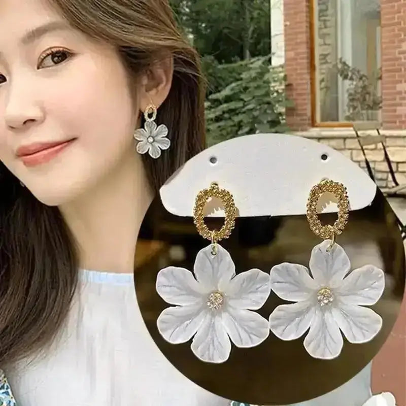 Korean fashion pearl tassel earrings with needle detail, featuring small white pearls on silver hooks for a trendy, elegant look.