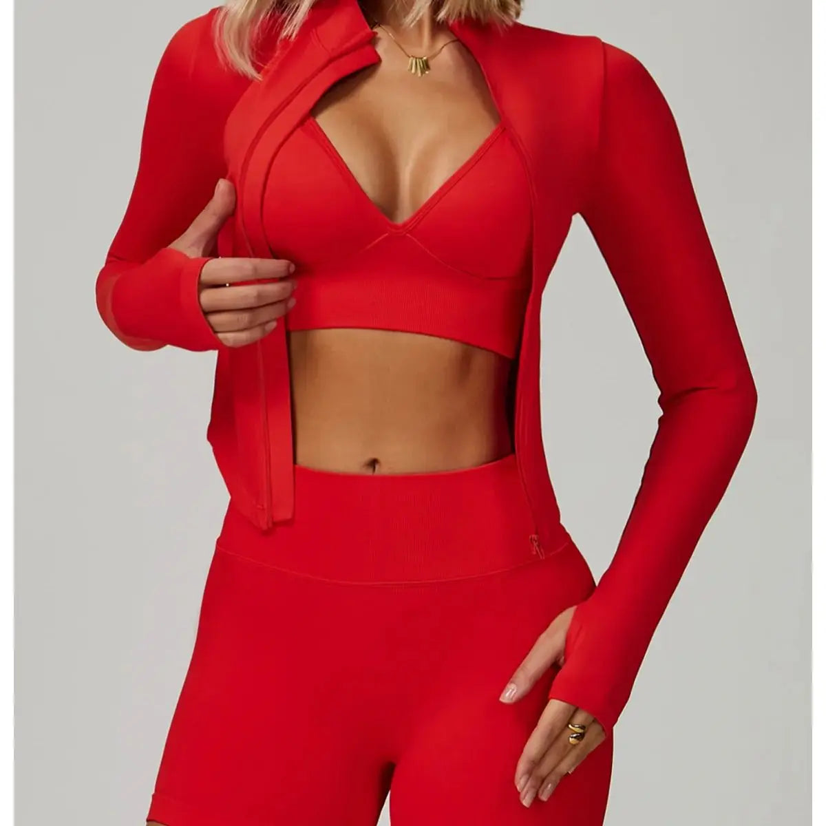 Seamless black 2/3-piece yoga sports set from Corporación Turística, including sports bra and leggings, displayed on a white background.