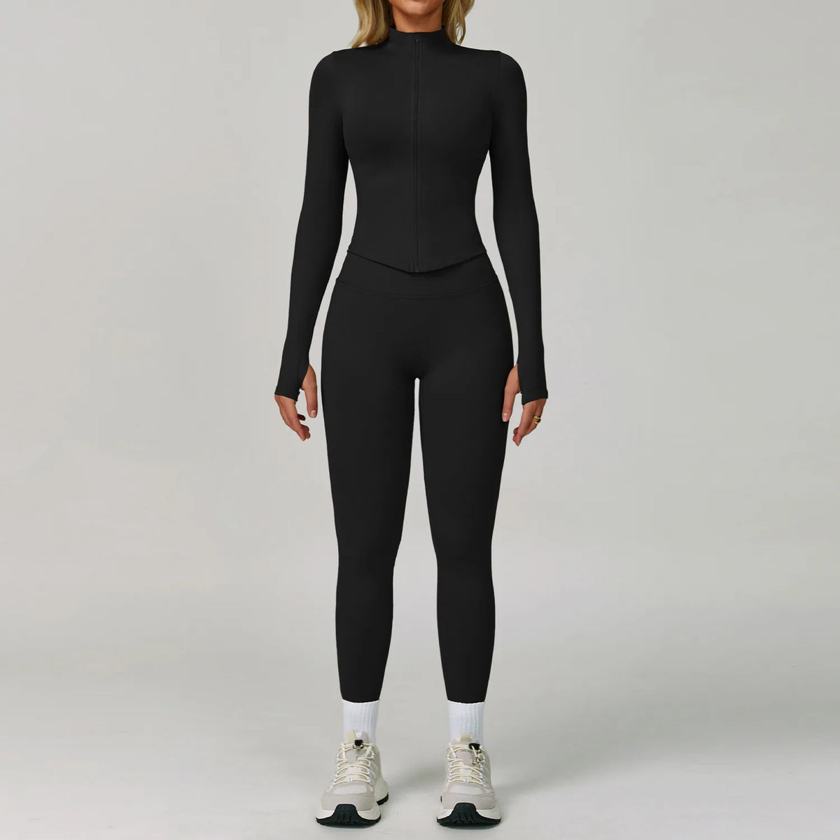 Black seamless 2/3 piece yoga sports set from Corporación Turística, includes a fitted sports bra and matching leggings.